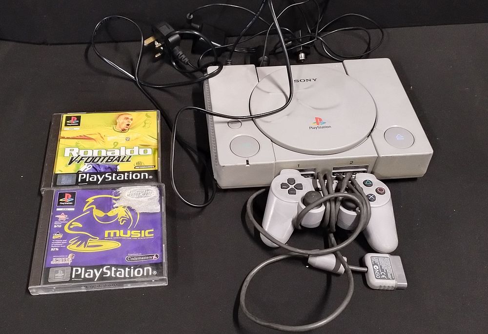 Lot 310: Sony PlayStation 1 Console and 1 controller with...