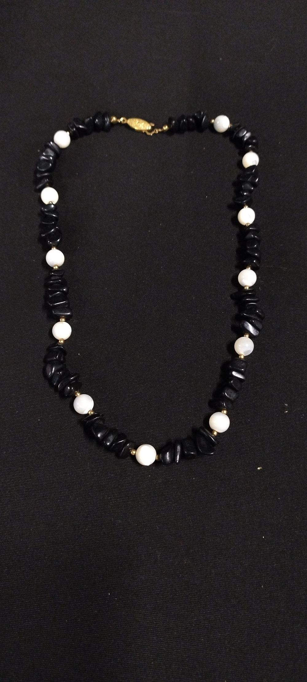 Lot 345: Black agate and white bead necklace with gold...