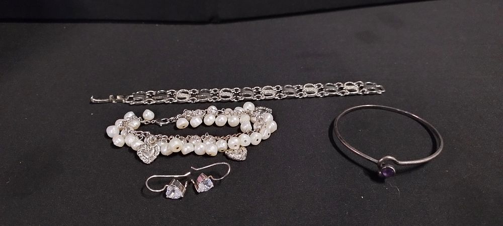 Lot 348: 3 bracelets including silver and amethyst, pearl, and...