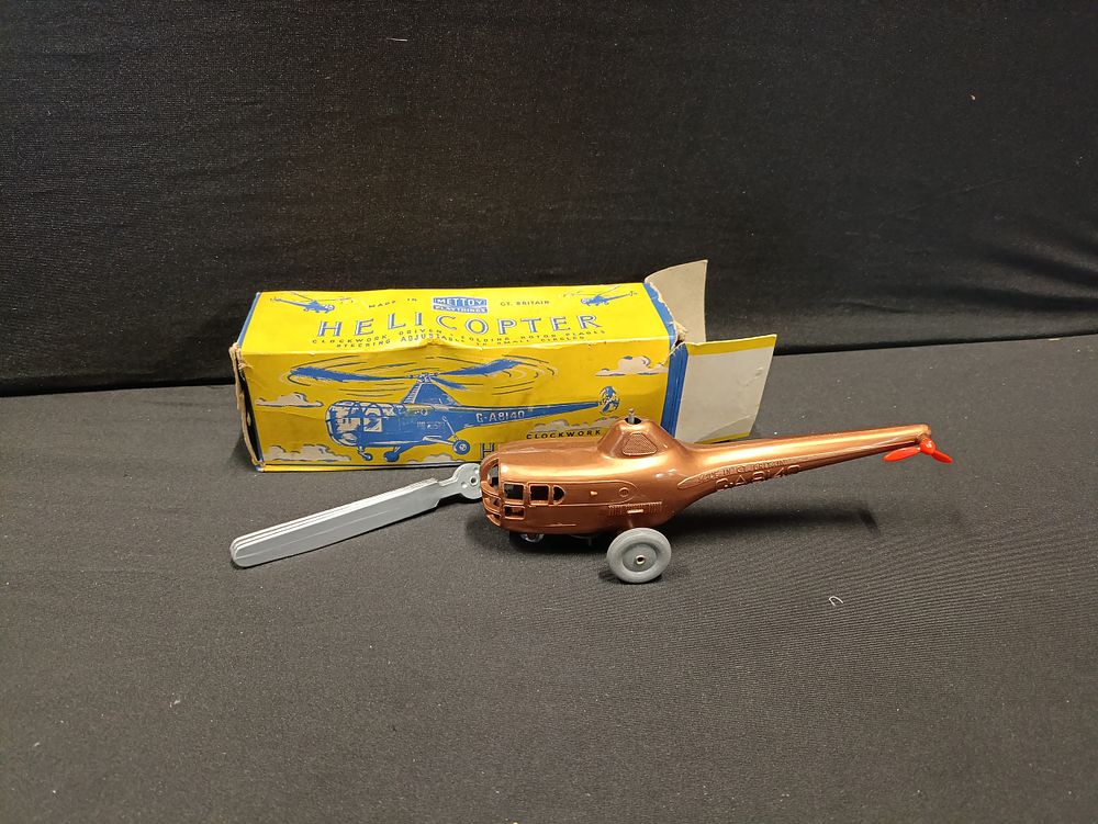 Lot 391: Vintage Bronze Metttoy Clockwork Helicopter in original box