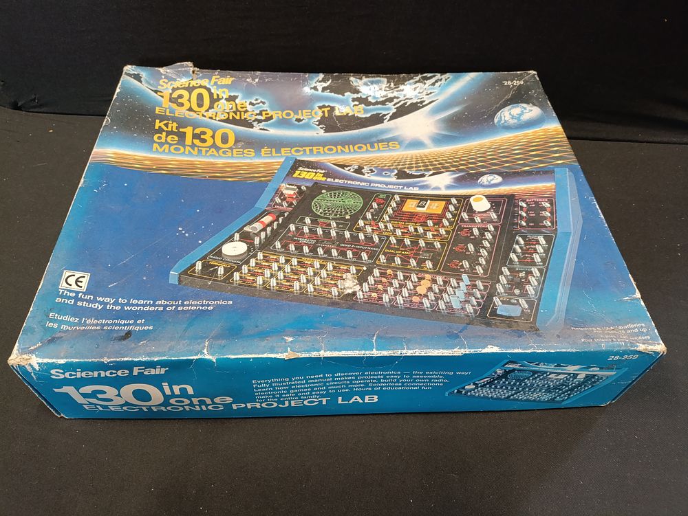 Lot 394: Vintage science fair electronic projects lab.