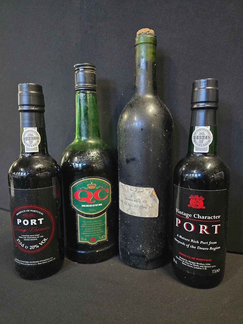 Lot 421: Four bottles, thre sealed of QC, port and...