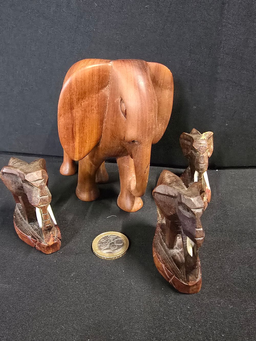 Lot 432: Four vinatge wooden elephants, various sizes