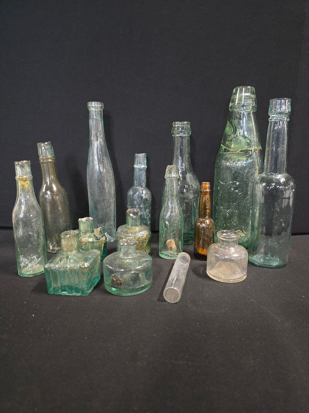 Lot 437: A.collection of vintage glass bottles. Various sizes and...