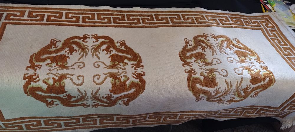 Lot 458: Large rug with dragon design Measures approx L...