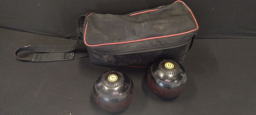 Lot 490: Bag containing 2 crown green Bowls.