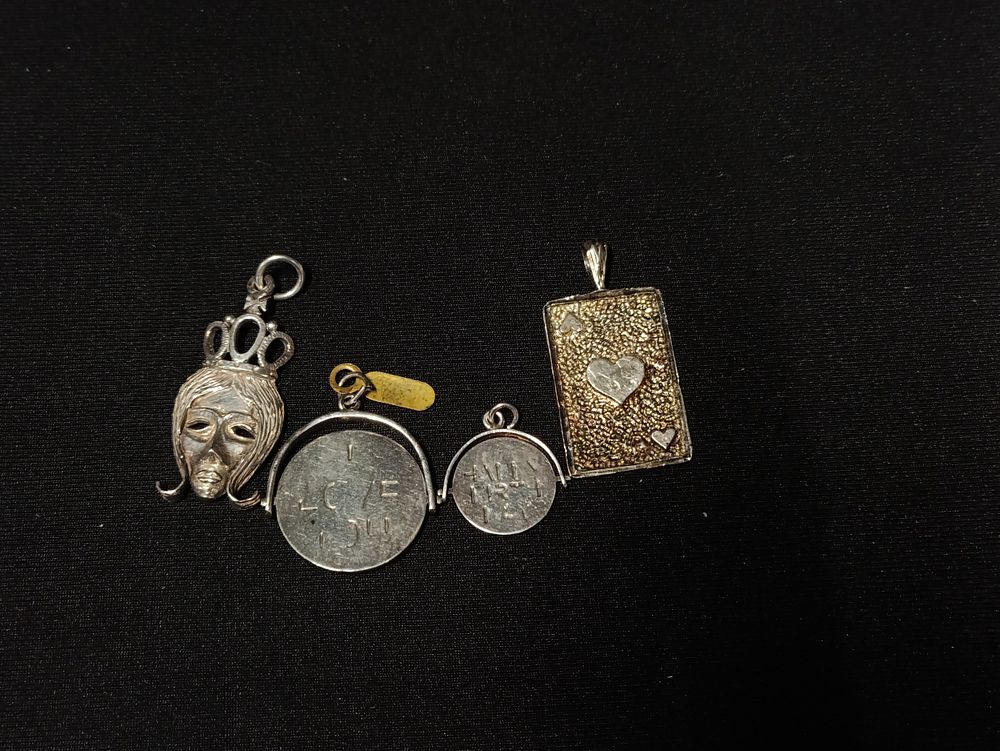 Lot 474: Four vintage pendants including sterling silver