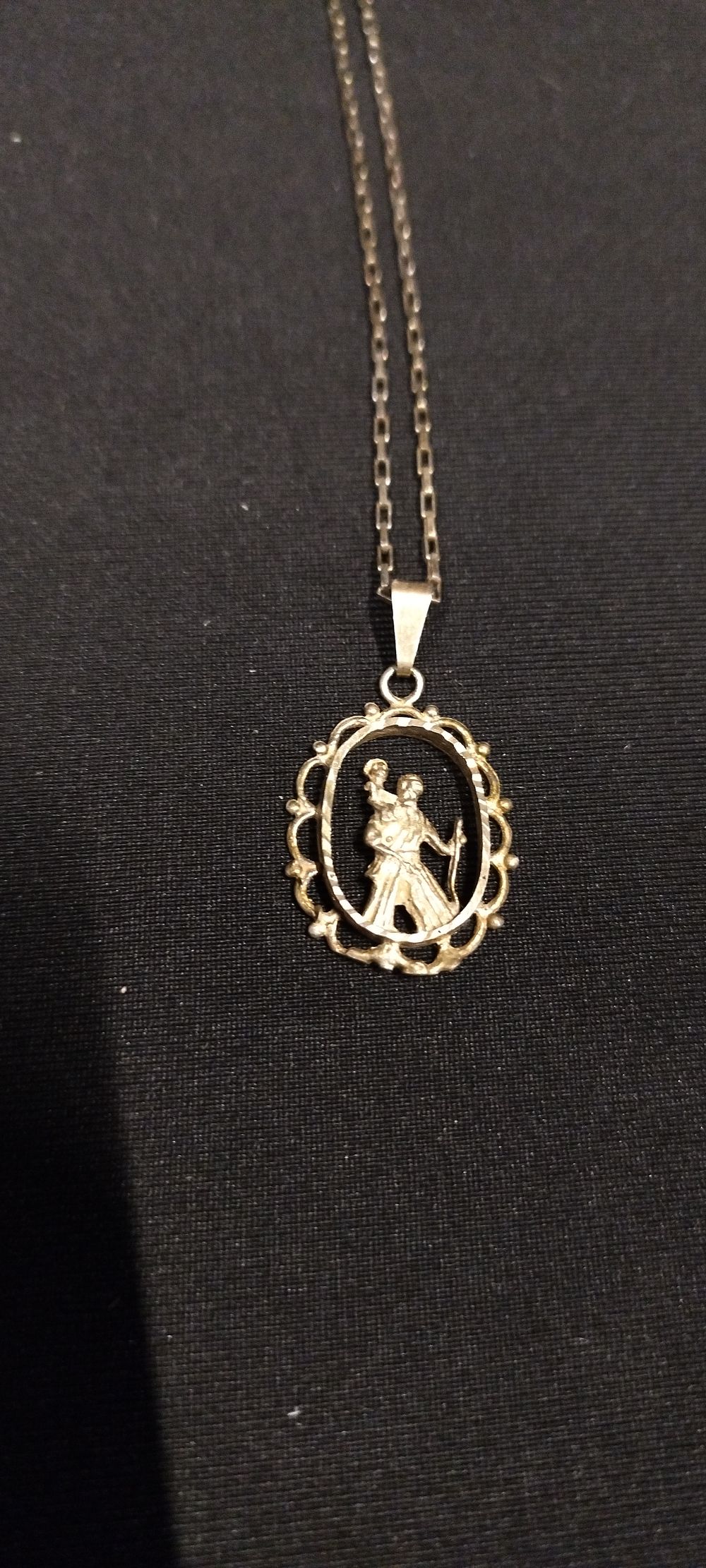 Lot 484: Sterling silver st Christopher with pierced work. Chain...