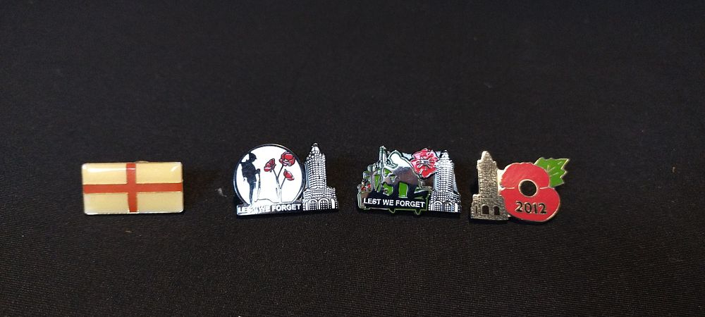 Lot 53: 4 x pin badges 3 poppy featuring Darwen...