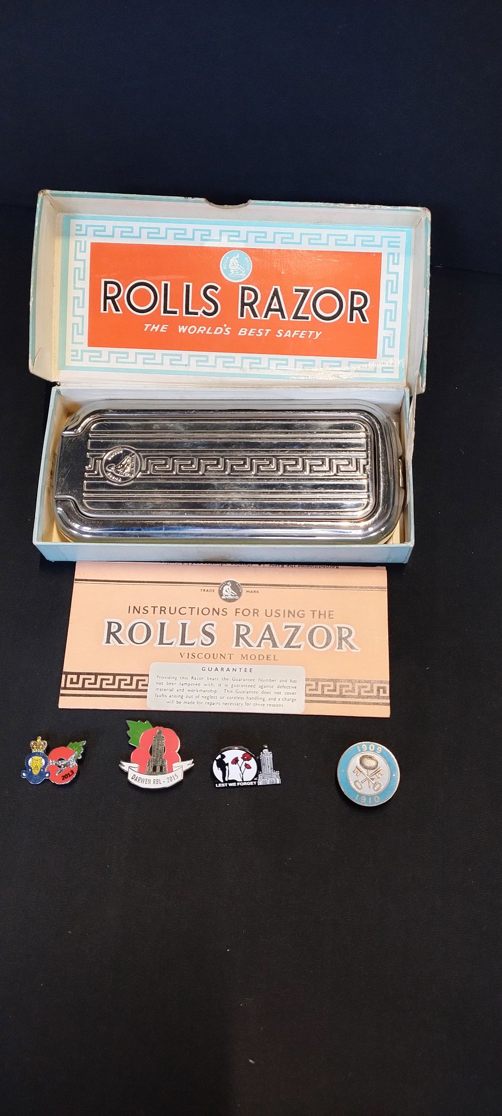 Lot 56: Vintage Rolls Razor, and 3 x poppy pin...