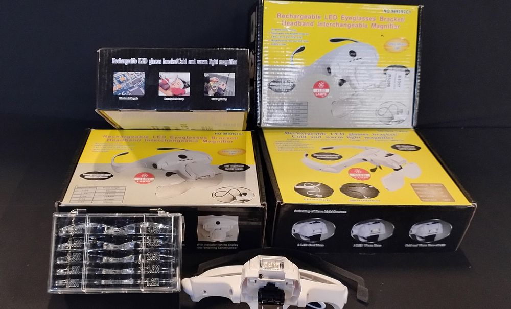 Lot 185: 4 X boxes of Rechargeable LED interchangeable Eyeglasses...
