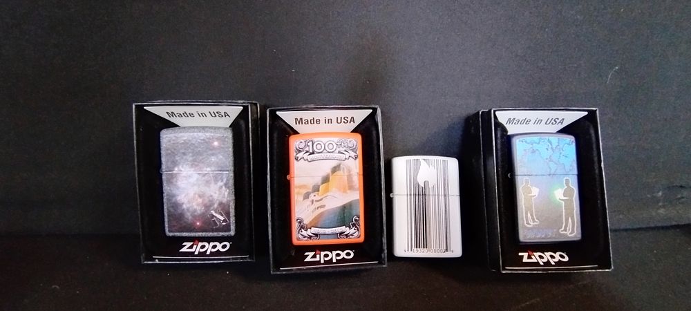 Lot 187: 4 Zippo lighters in various designs