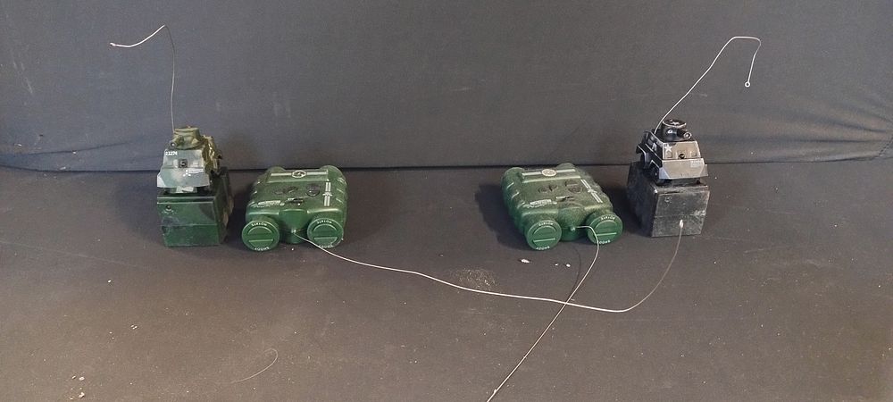 Lot 221: 2 x Mini remote control tanks and controls