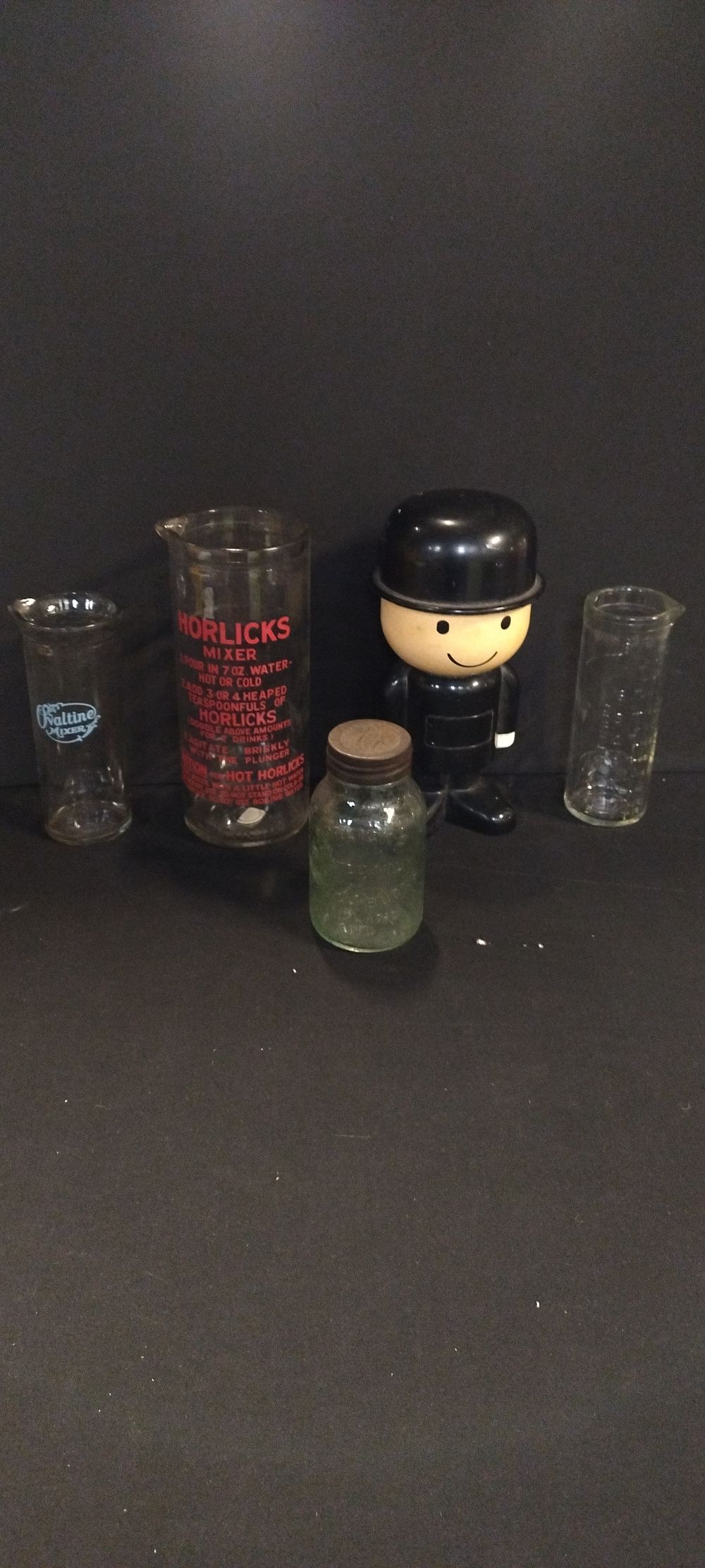 Lot 256: Vintage Horlicks and Ovaltine mixer jars and a...