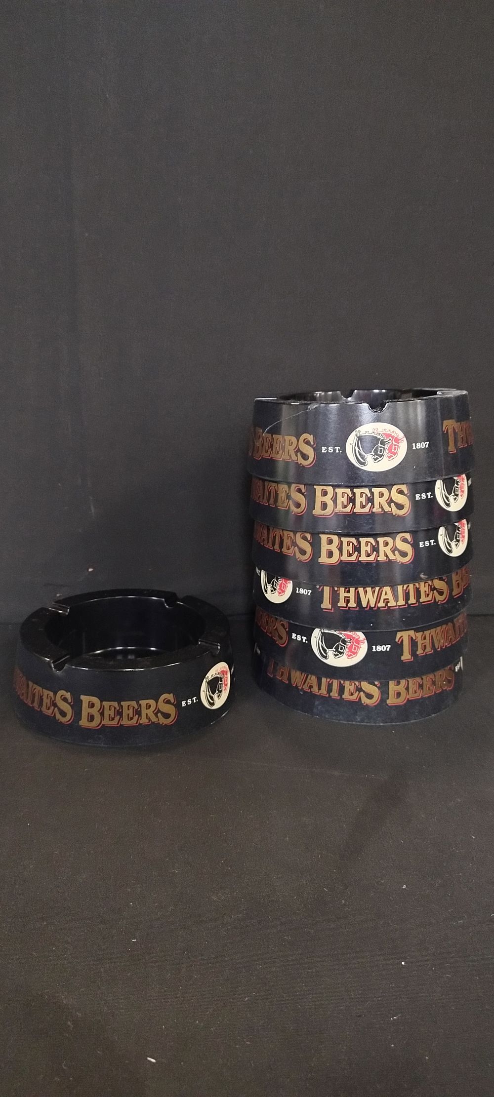 Lot 270: 7 x Thwaites black ashtrays