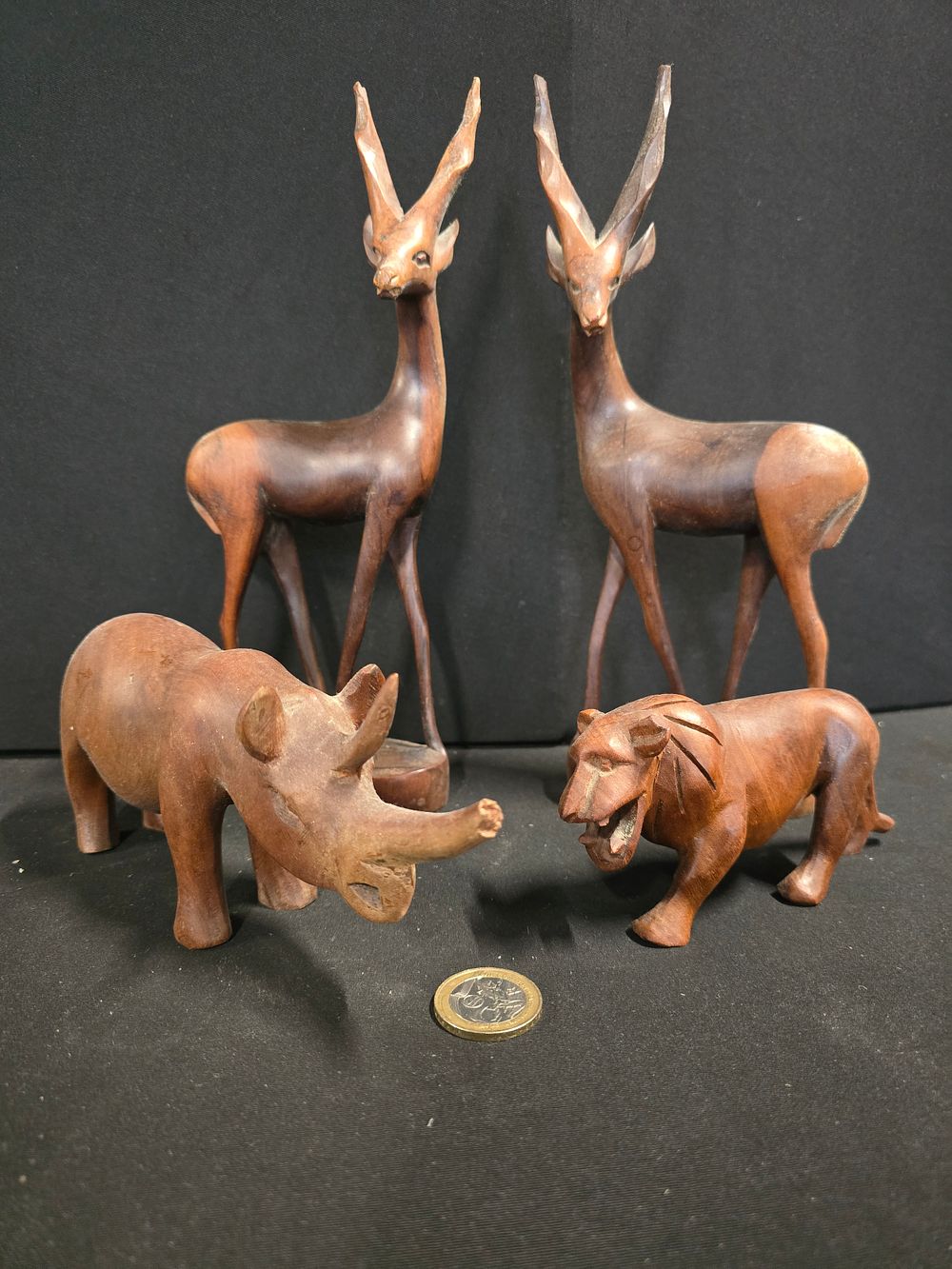 Lot 295: Four pieces of wooden carved animals including Rhino,...