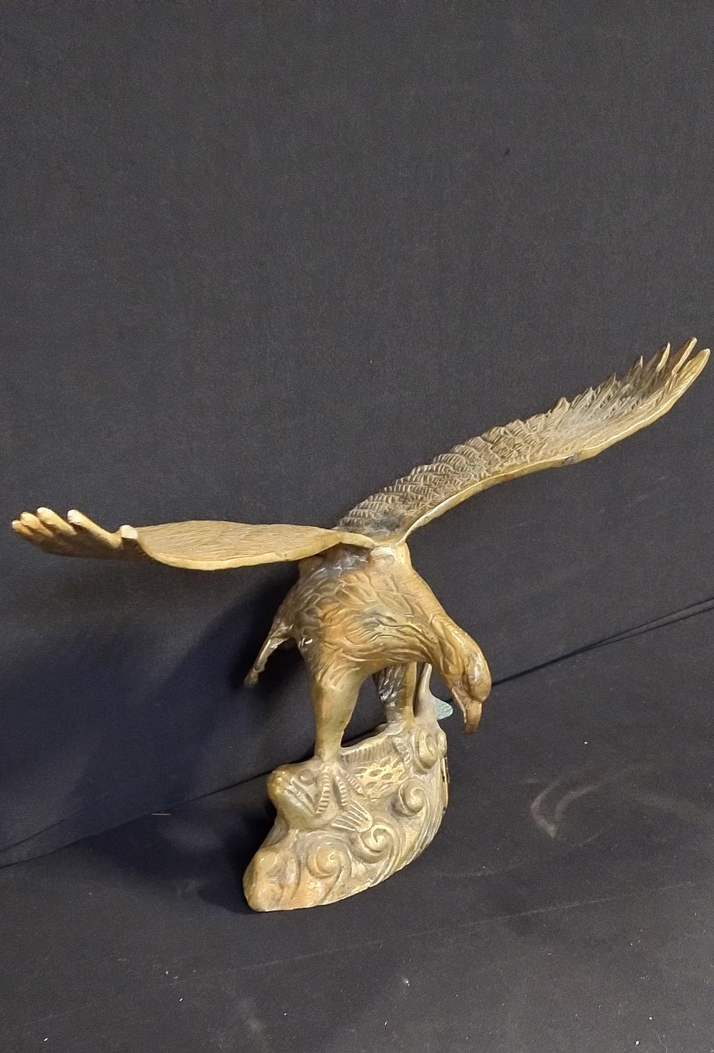 Lot 350: Two solid brass bird. One Eagle statue and...