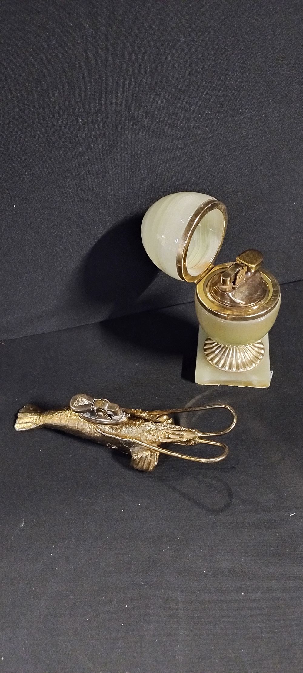 Lot 351: vintage onyx table lighter, and a lobster gas...