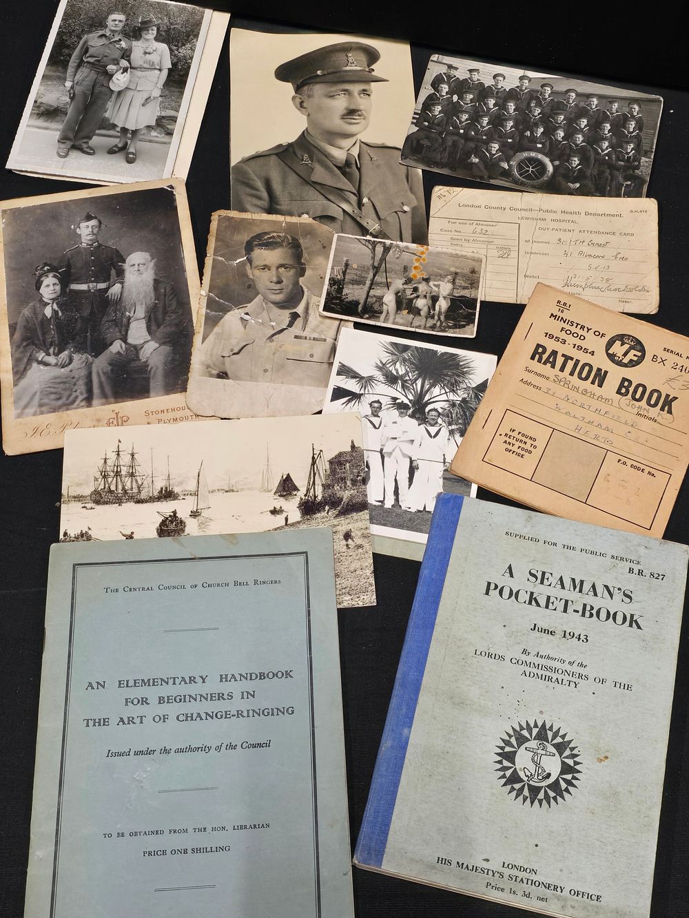 Lot 406: A selection of military pictures, ration book, Elementary...