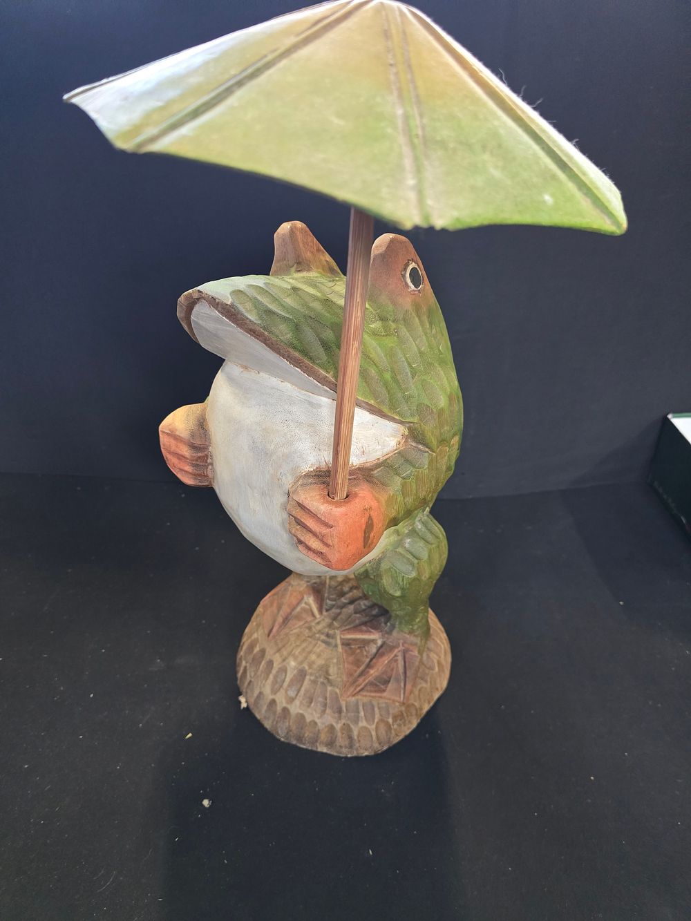 Lot 483: A heavy wooden Frog with umbrella