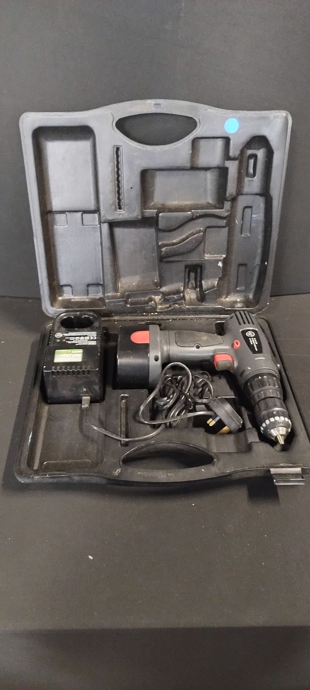 Lot 519: Performance Power,14.4V Cordless Hammer drill with battery charger...