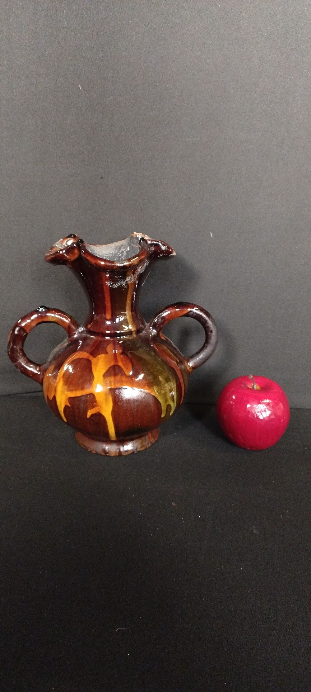 Lot 157: Vase with handles in flame effect glaze, measures...