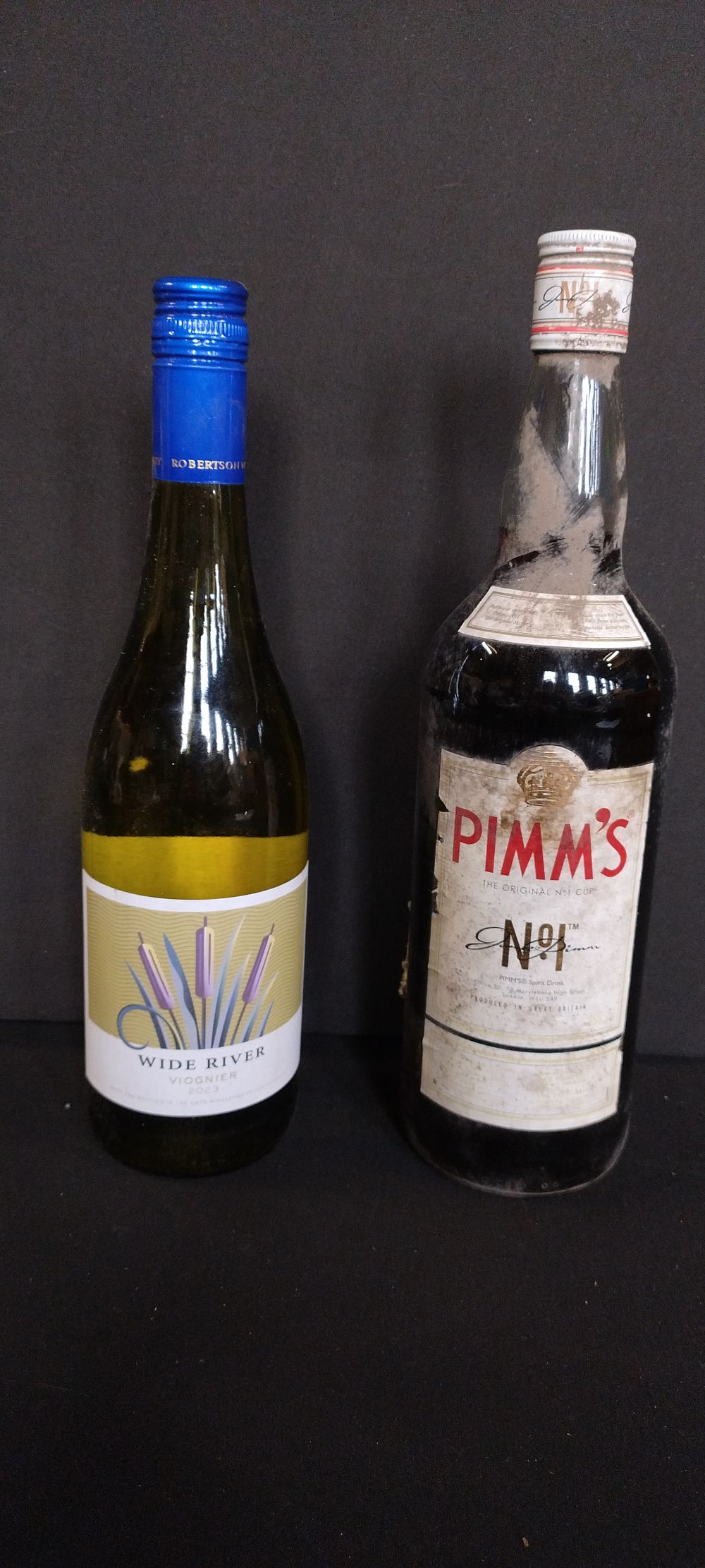 Lot 174: Two bottles of unopened alcohol, Wide River white...