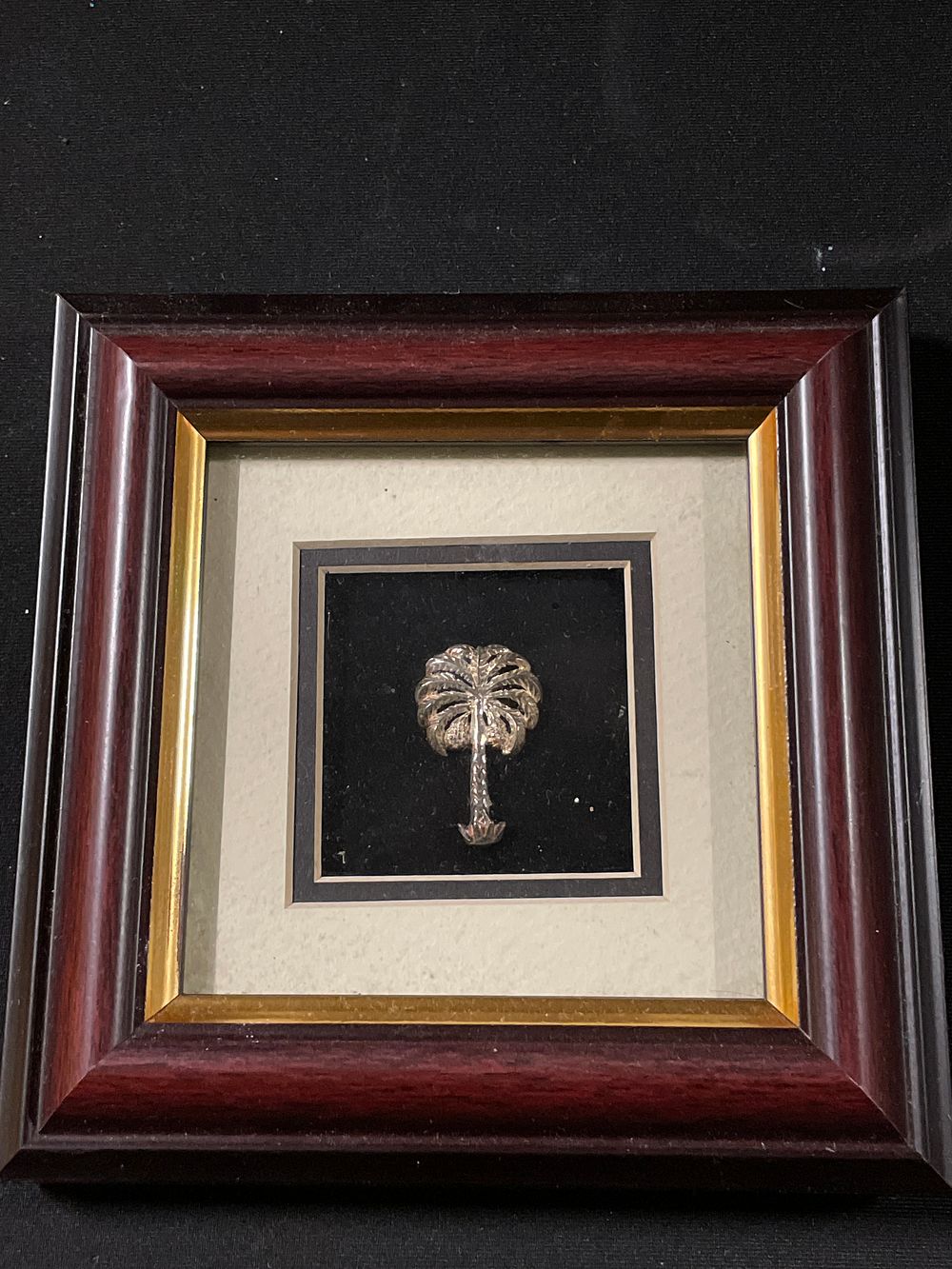 Lot 242: Silver coloured palm tree in frame