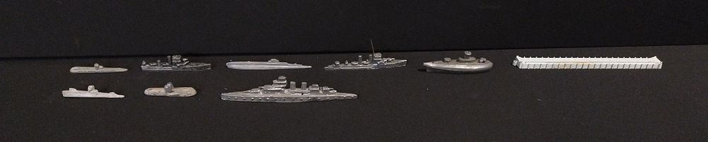 Lot 249: 8 x vintage metal submarines and war ships