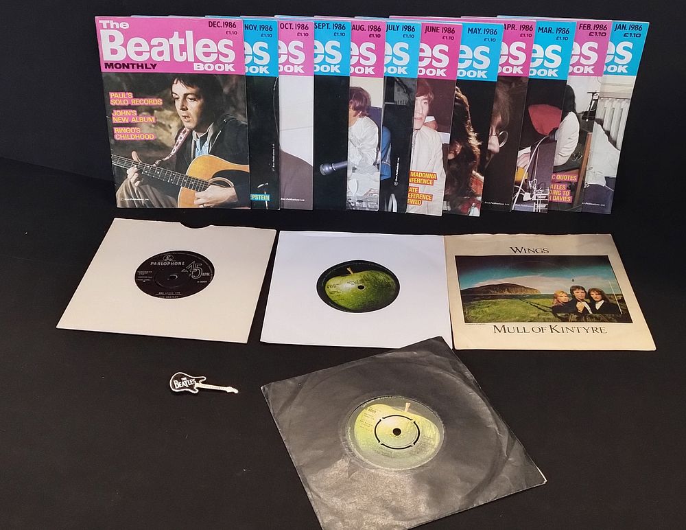 Lot 254: Full year of Beatles monthly & guitar shaped...