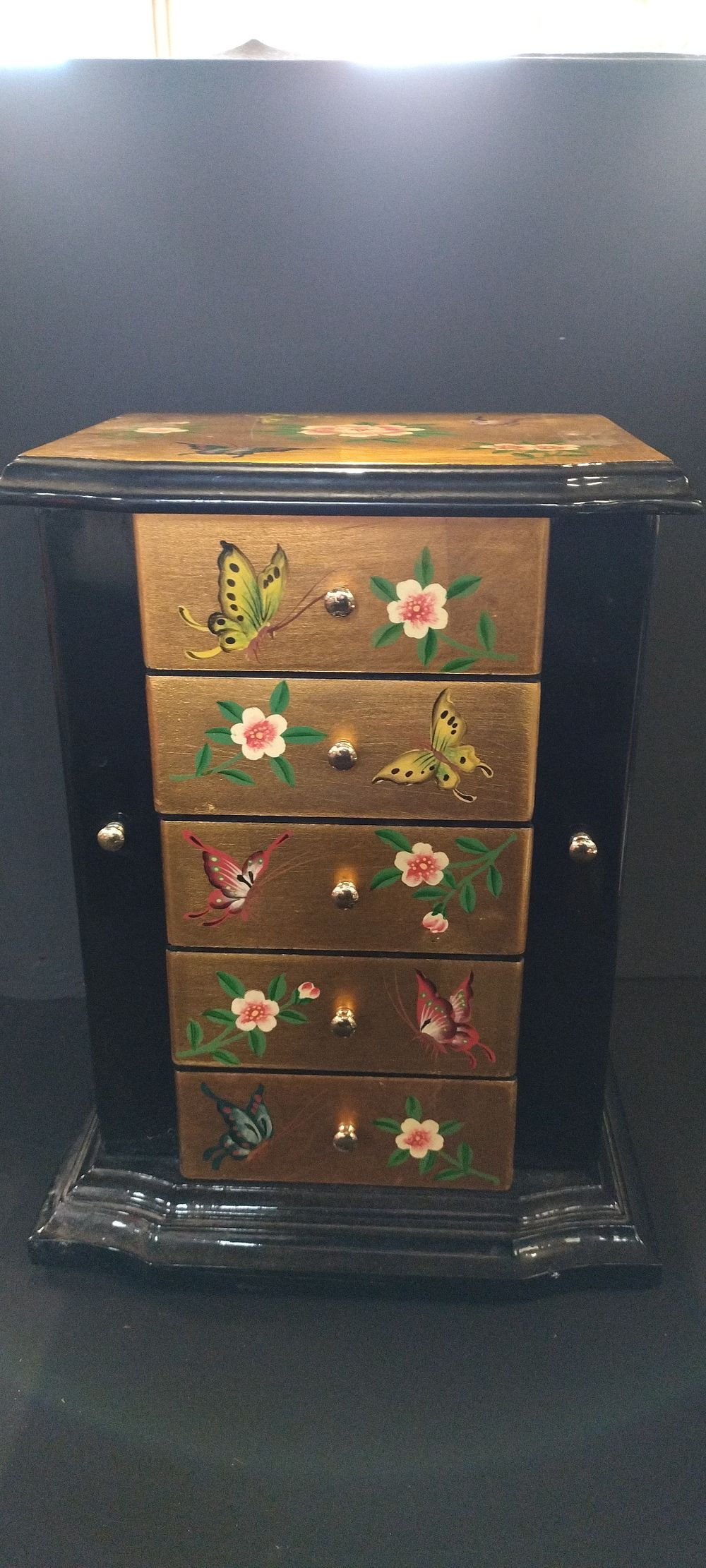 Lot 256: Gold and black with butterflies and flowers decoration...