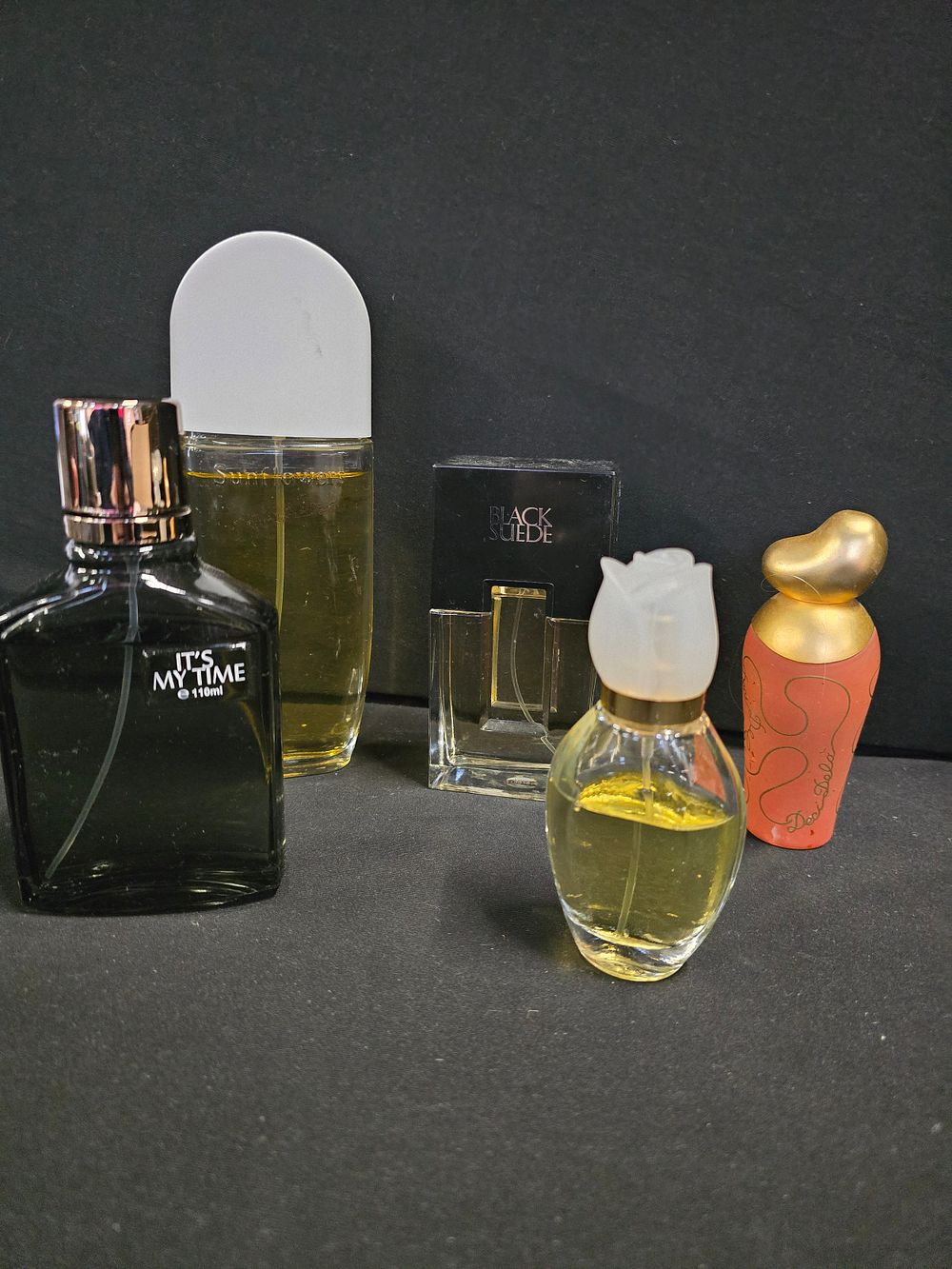 Lot 326: Five various perfume and aftershaves, mostly almost full...