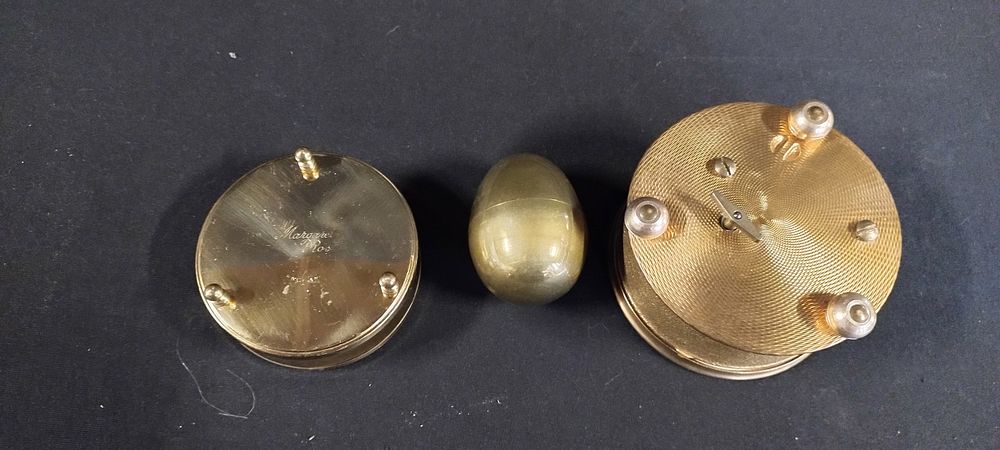 Lot 329: Brass egg, two trinket boxes one musical