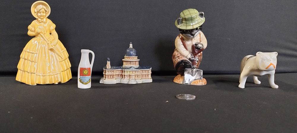 Lot 338: Various porcelain items including a Victorian lady, bulldog...