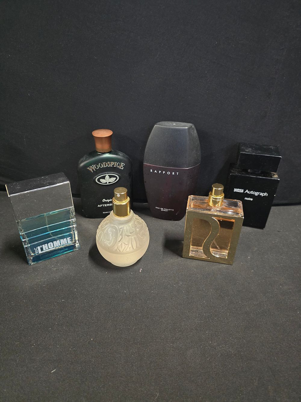 Lot 343: Six aftershaves and perfumes