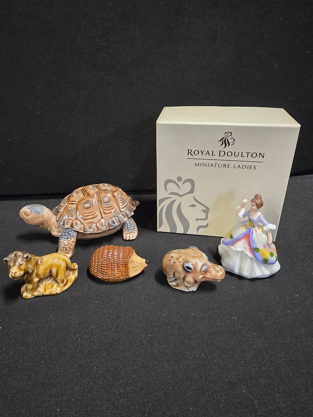 Lot 350: WADE whimsies and a Roayl Doult miniture ladies...
