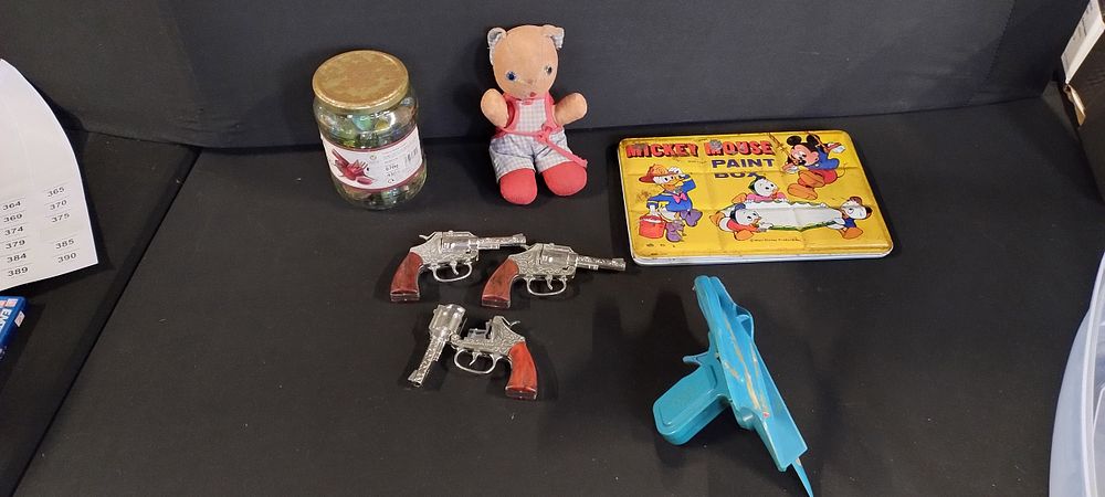 Lot 363: Vintage children's toys cap gun's, jar of marbles,...