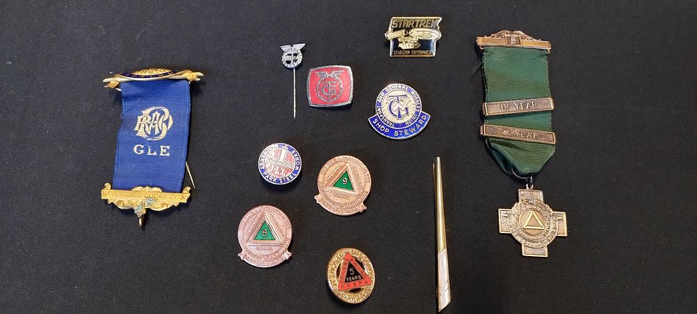 Lot 426: Selection of drivers award pin badges, and a...