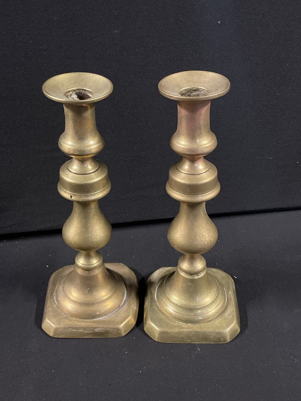 Lot 437: Pair of antique brass candlesticks