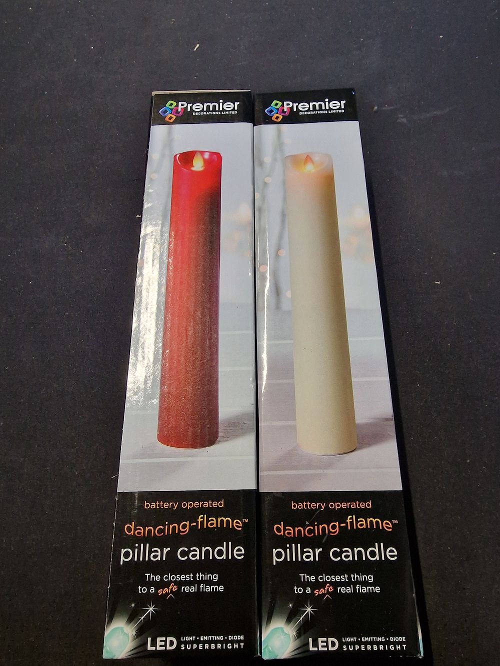 Lot 329: White and red Christmas LED dancing flame pillar candles