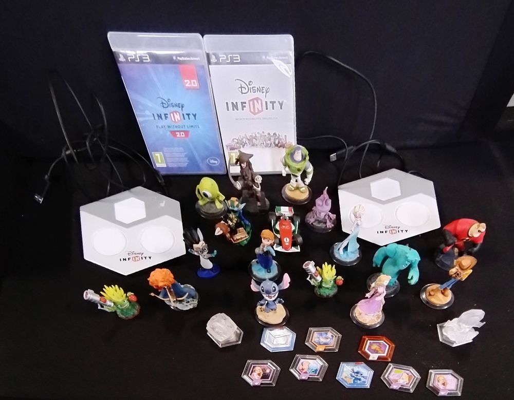 Lot 467: PS3 Disney Infinity games and various figures