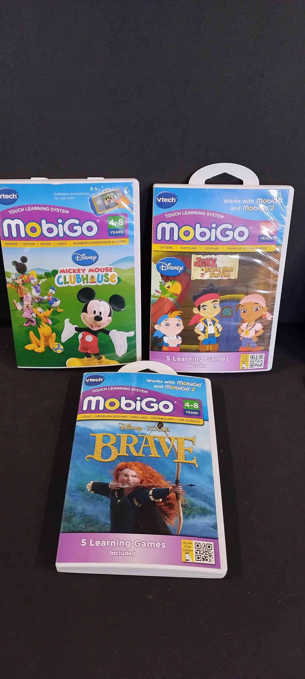 Lot 470: 3 x Vtech mobigo Touch learning system games,...