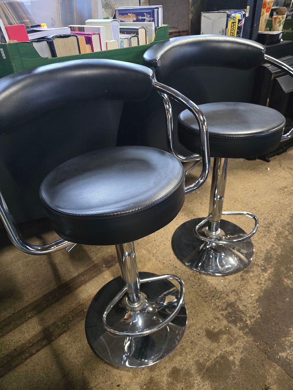 Lot 480: A pair of faux black leather adjustable bar...