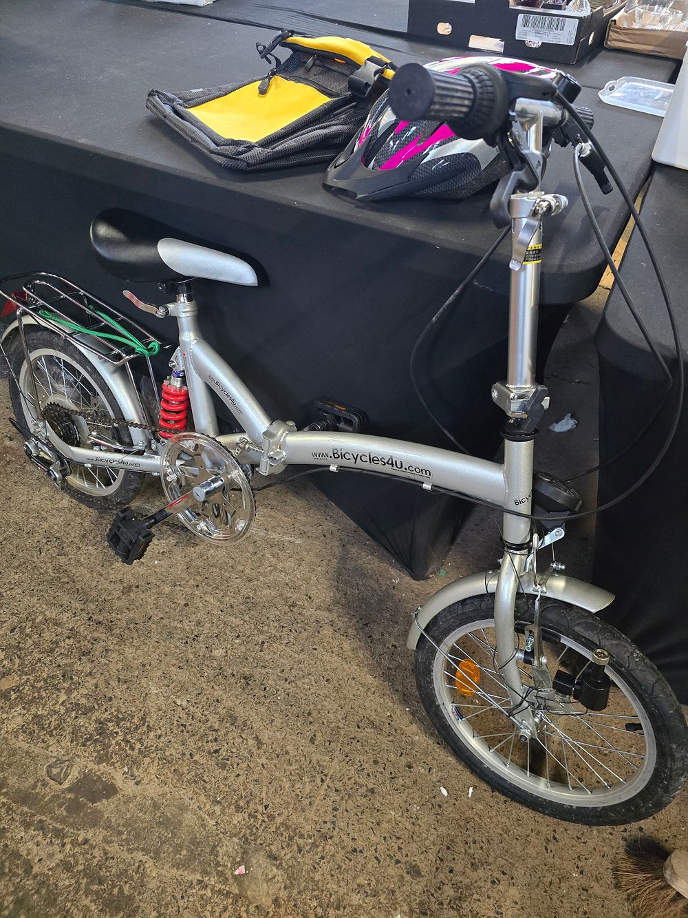 Lot 495: Like new folding bike with storage bag and...