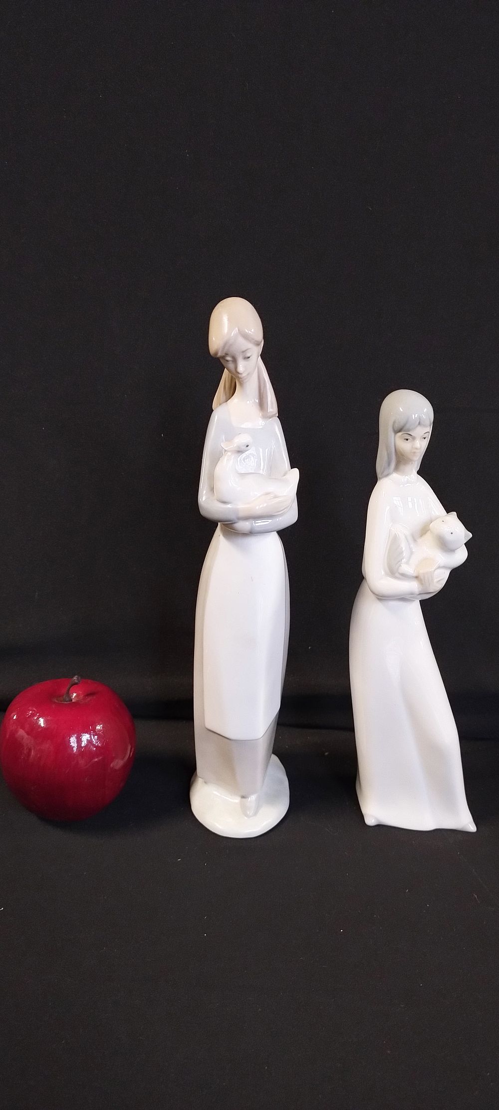 Lot 510: Nao figurine, girl with duck, and a Miquel...