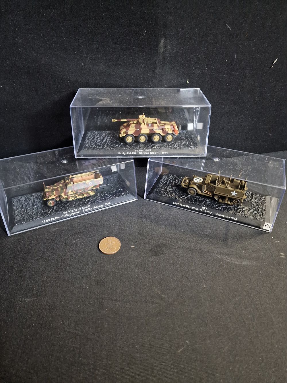Lot 184: Three Model Military Vehicles in Display Cases
