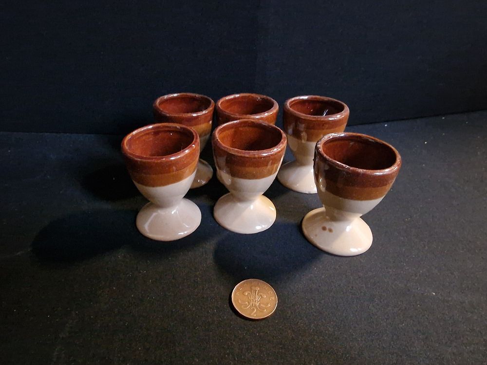 Lot 237: Six Stoneware Style Eggcups