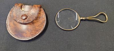 Antique monacle in a leather pouch