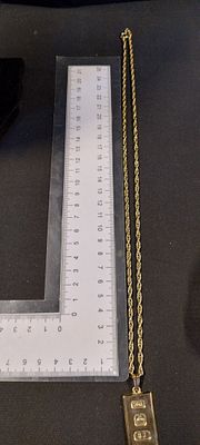 22ct gold plated ingot on chain. Chain measures approx L 22 inch,