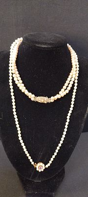 String of pearls with a 9ct gold clasp and amethyst, and a set of faux pearls